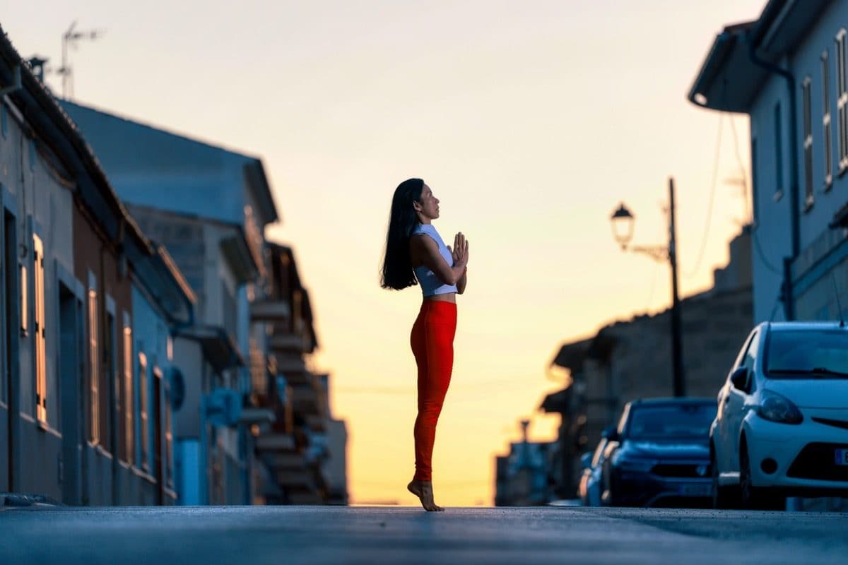 Wipa standing calmly in a simple prayer pose outdoors